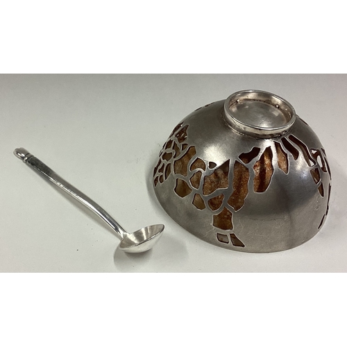 436 - A heavy Modernistic silver bowl with pierced contemporary decoration together with a salt spoon. App... 