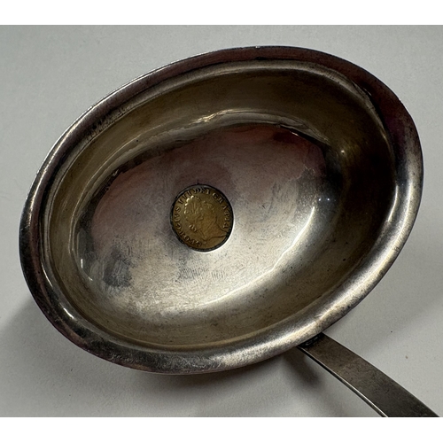 445 - A silver toddy ladle inset with gold coin. London 1803. Approx. 56 grams. Est. £200 - £300.