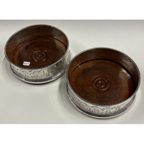 447 - A fine pair of silver coasters with engraved skyline scenes. London 1970. By CJ Vander. Approx. 430 ... 