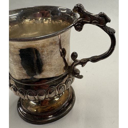 47 - A George III silver christening mug cast with naturalistic animal handle. London 1822. Approx. 108 g... 