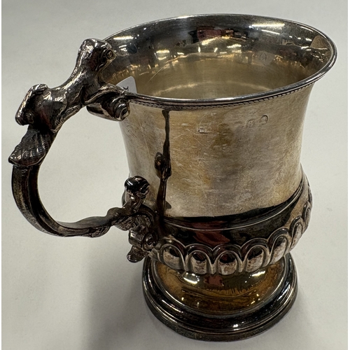 47 - A George III silver christening mug cast with naturalistic animal handle. London 1822. Approx. 108 g... 