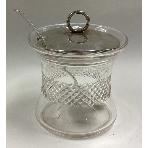 497 - A silver honey jar and spoon with glass liner. Sheffield 1906. Est. £40 - £60.