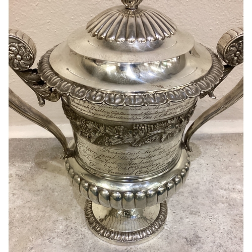 54 - A large and impressive silver trophy cup and cover embossed with vines presented to 'Walton and Weyb... 