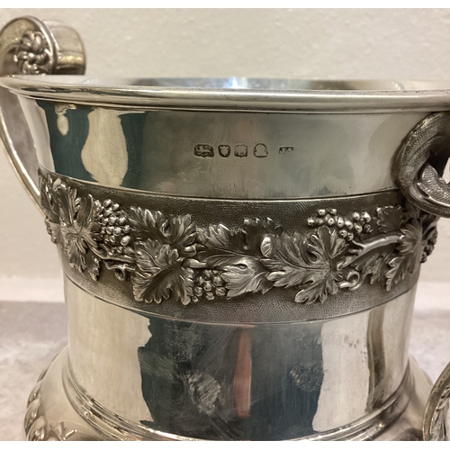 54 - A large and impressive silver trophy cup and cover embossed with vines presented to 'Walton and Weyb... 