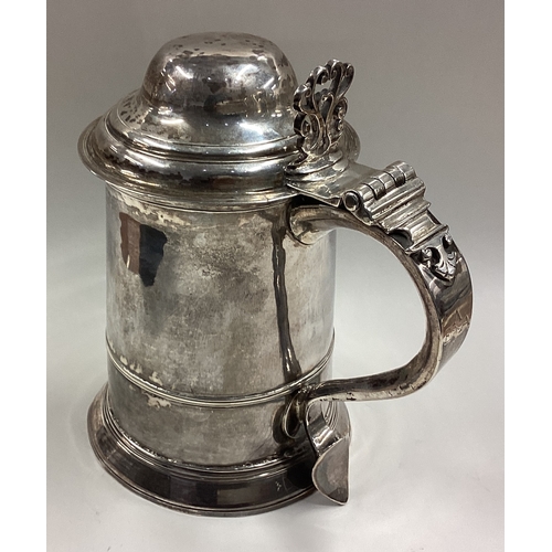 549 - A George III silver lidded tankard. London 1784. By Charles Hougham. Approx. 551 grams. Est. £1000 -... 