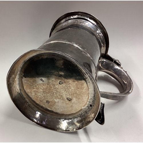 549 - A George III silver lidded tankard. London 1784. By Charles Hougham. Approx. 551 grams. Est. £1000 -... 