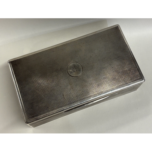 552 - A large engine turned silver cigar box. London 1919. By Mappin & Webb. Approx. 1217 grams of gross w... 