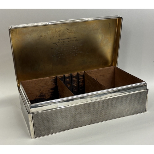 552 - A large engine turned silver cigar box. London 1919. By Mappin & Webb. Approx. 1217 grams of gross w... 