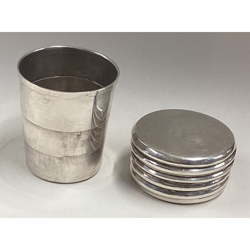 558 - A silver collapsible beaker contained within original silver case. London 1997. By AN. Approx. 43 gr... 