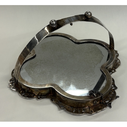 561 - An Art Nouveau silver mounted mirror with bird decoration.  Est. £120 - £150.