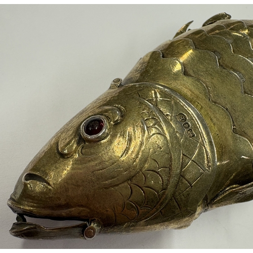 57 - A rare and fine German silver gilt articulated figure of a fish bearing English import marks. London... 