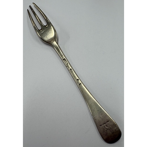 58 - An 18th Century George I silver three-prong fork. Approx. 30 grams. Est. £80 - £120.