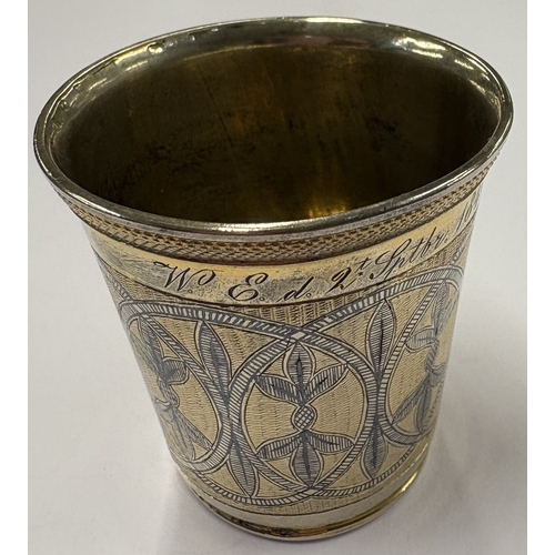 59 - A good Russian silver gilt and Niello beaker. Marked to interior. Dated 1840. Approx. 54 grams. Est.... 