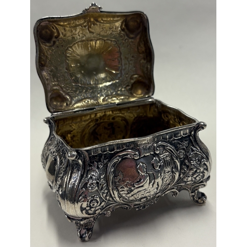 60 - A heavy 19th Century German silver tea caddy embossed with flowers on four feet. Approx. 219 grams. ... 