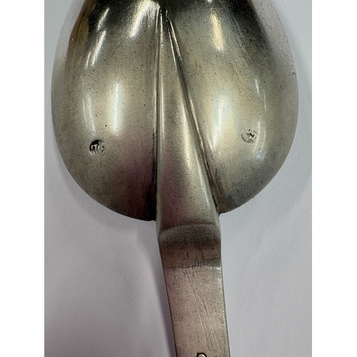 605 - A large 18th Century Continental silver spoon with engraved floral decoration. Marked to reverse. Ap... 