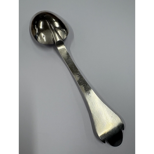 605 - A large 18th Century Continental silver spoon with engraved floral decoration. Marked to reverse. Ap... 