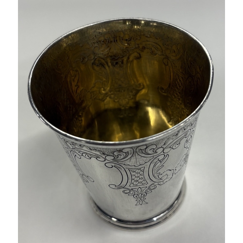 609 - An 18th Century George III silver beaker. Marked to base with incuse Georgian King's head. London 17... 