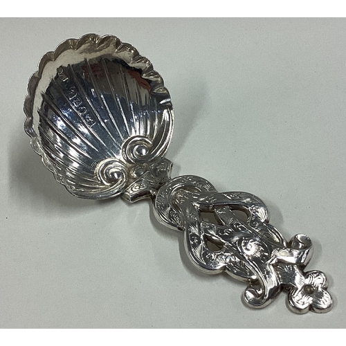 614 - An attractive chased Victorian silver caddy spoon with fluted bowl. Birmingham. By FC. Approx. 10 gr... 