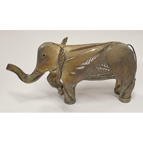 632 - An Indian silver figure of an elephant with filigree decoration. Approx. 61 grams. Est. £60 - £80.