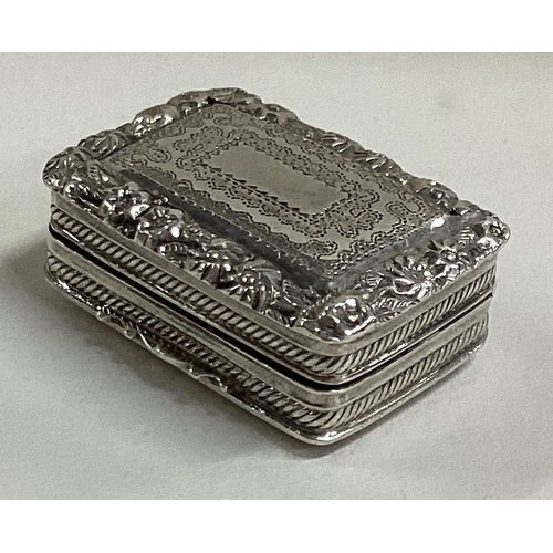 643 - A bright-cut silver vinaigrette with gilt interior. Birmingham. By Thomas & William Simpson. Approx.... 