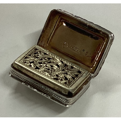 643 - A bright-cut silver vinaigrette with gilt interior. Birmingham. By Thomas & William Simpson. Approx.... 