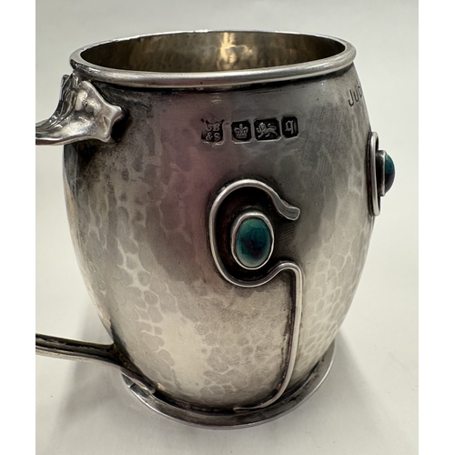 67 - An Arts and Crafts silver mug decorated with blue stones. Sheffield 1908. By Cooper Brothers & Sons ... 