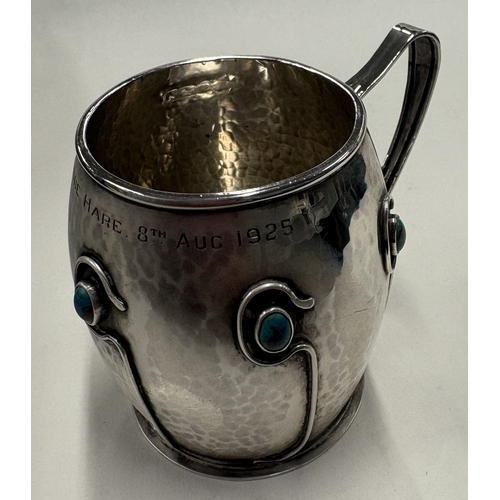 67 - An Arts and Crafts silver mug decorated with blue stones. Sheffield 1908. By Cooper Brothers & Sons ... 