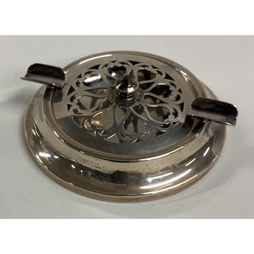 676 - An unusual pierced silver ash tray with lift-off cover. Birmingham. Approx. 68 grams. Est. £40 - £60... 