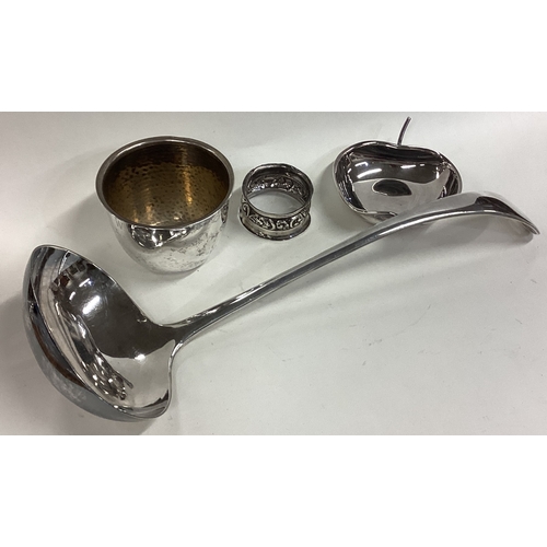 679 - A good silver plated ladle together with a cup, napkin ring etc. Est. £20 - £30.