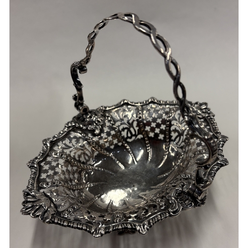 69 - An 18th Century George III silver swing handled basket with pierced decoration. London 1763. Approx.... 