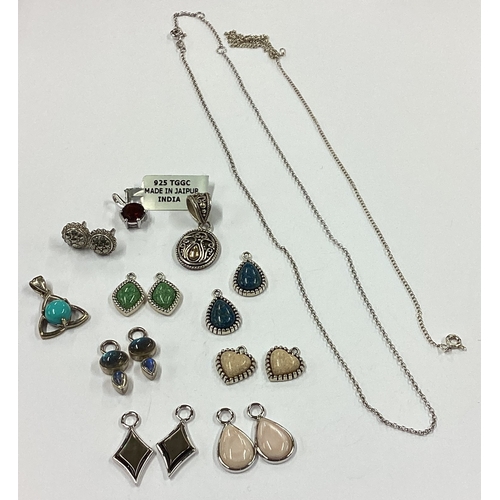 707 - A large collection of silver gem set pendants etc. Approx. 20 grams. Est. £20 - £30.