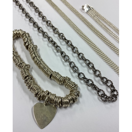 710 - Two silver necklaces together with a bracelet etc. Approx. 48 grams. Est. £30 - £50.