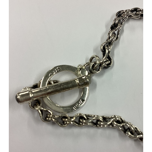 728 - A Continental silver Albert chain with bar. Approx. 16 grams. Est. £10 - £20.