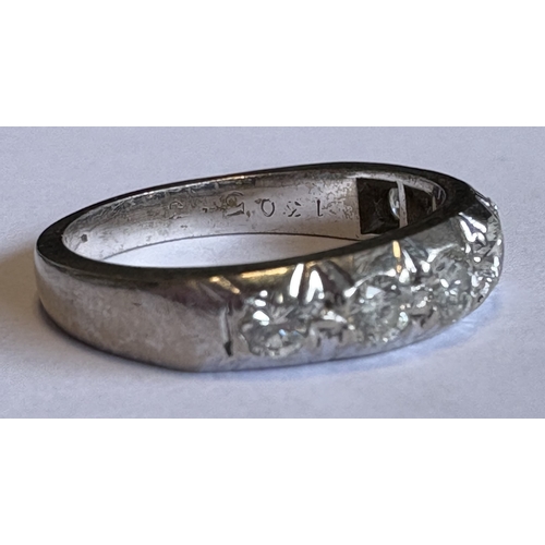 748 - A good diamond seven-stone ring set in 18 carat white gold. Approx. ring size L. Approx. 5 grams. Es... 