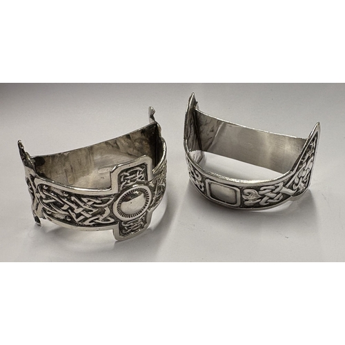 79 - GLASGOW: A rare pair of Art Nouveau Scottish silver napkin rings. 1951. By Michael Serebriany. Appro... 