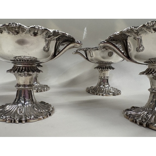 8 - An attractive set of four chased Victorian silver salt cellars with handles. London 1848. By John & ... 