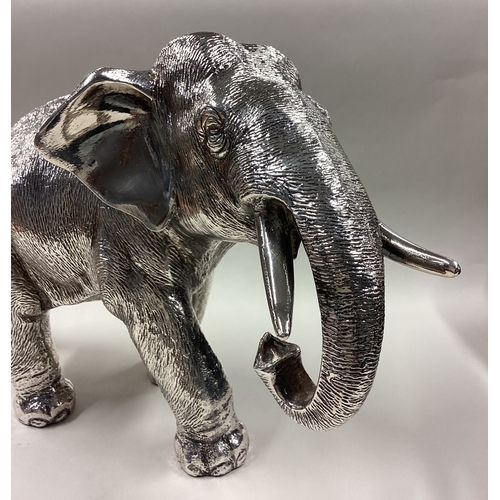 94 - A Naturalistic silver figure of an elephant. Sheffield 1998. Approx. 1274 grams of gross weight. Est... 