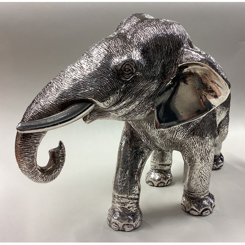 94 - A Naturalistic silver figure of an elephant. Sheffield 1998. Approx. 1274 grams of gross weight. Est... 