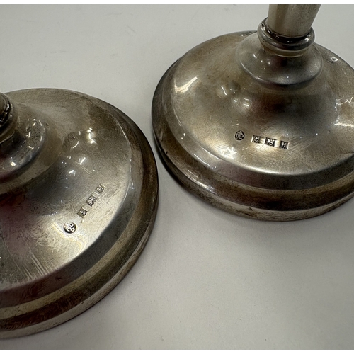 96 - A pair of silver candlesticks. Birmingham 1957. Approx. 256 grams. Est. £60 - £80.