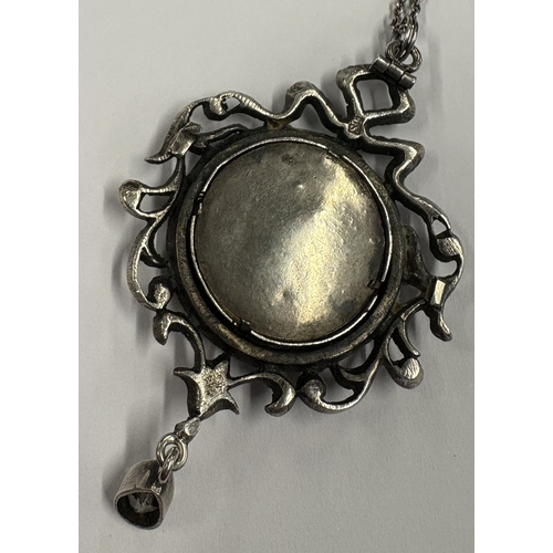 768 - A good Antique silver and paste pendant on fine link chain. Approx. 14 grams. Est. £50 - £80.