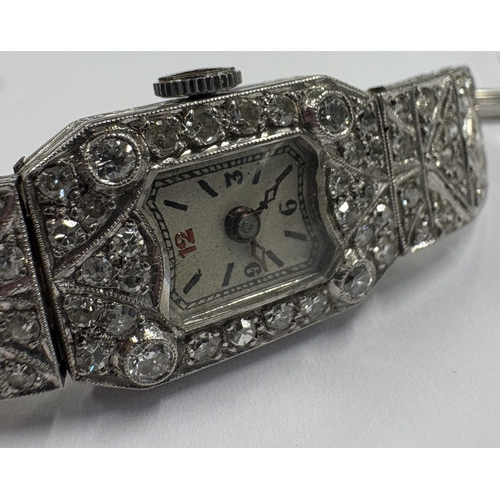 769 - An attractive diamond and platinum cocktail watch on mesh strap. Approx. 20 grams. Est. £800 - £1200... 