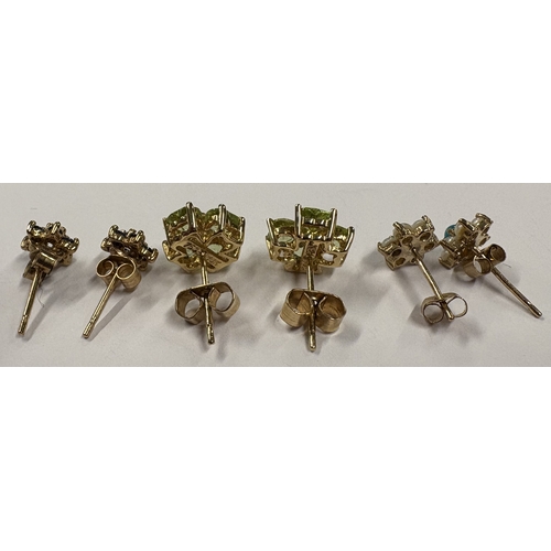 775 - A pair of green stone ear studs in gold setting together with two other pairs. Approx. 4 grams. Est.... 