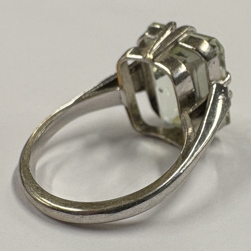 776 - A single-stone ring in 9 carat claw mount. Approx. ring size M. Approx. 5 grams. Est. £50 - £80.