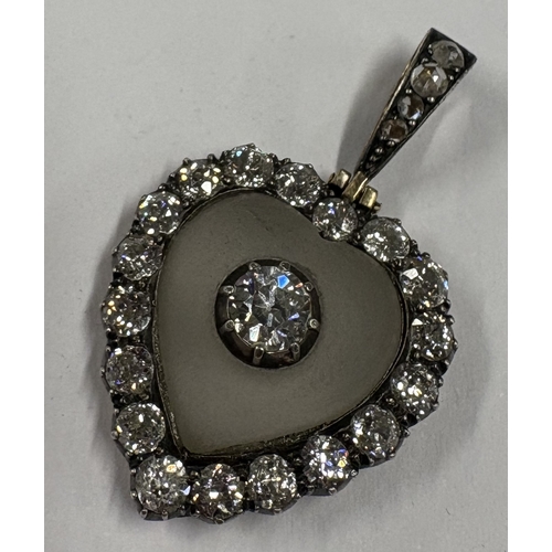 788 - A good quality Victorian rock crystal and diamond heart-shaped pendant with concealed clasp to loop ... 