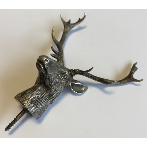 685 - A novelty Naturalistic early 20th Century silver finial in the form of a stag's head with textured b... 