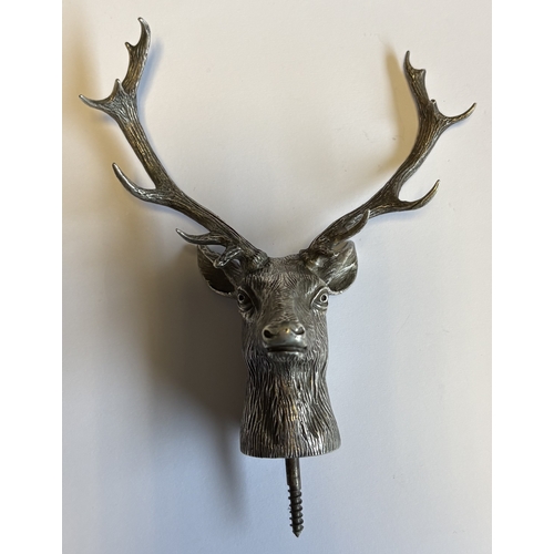 685 - A novelty Naturalistic early 20th Century silver finial in the form of a stag's head with textured b... 