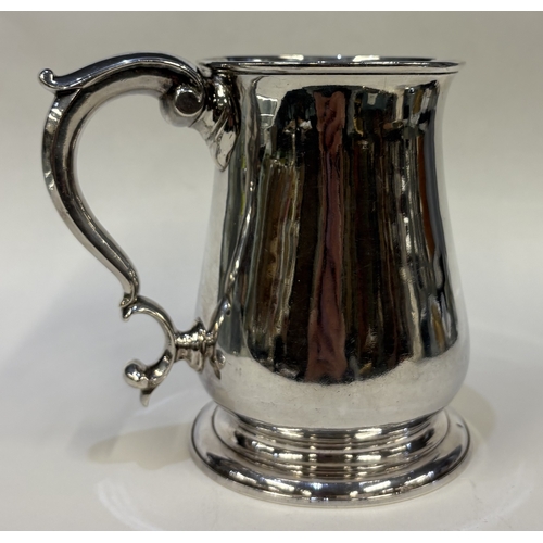 687 - EXETER: An early 18th Century George II silver baluster-shaped pint mug. 1750. By William Parry. App... 