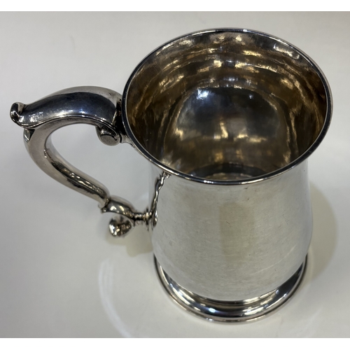 687 - EXETER: An early 18th Century George II silver baluster-shaped pint mug. 1750. By William Parry. App... 