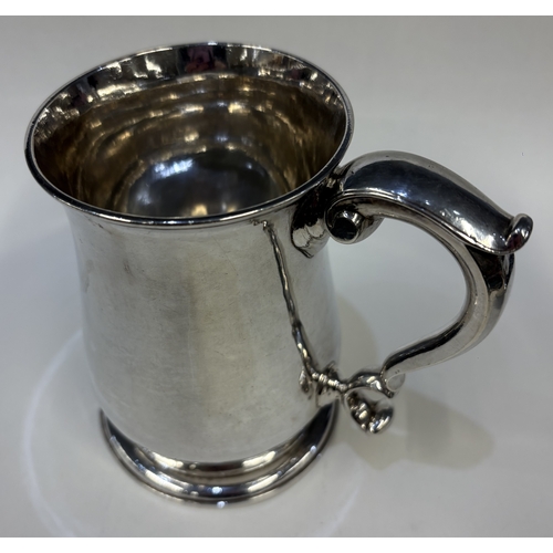 687 - EXETER: An early 18th Century George II silver baluster-shaped pint mug. 1750. By William Parry. App... 