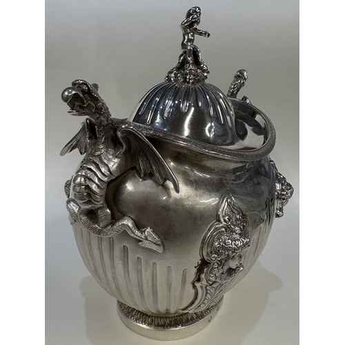 689 - A 19th Century silver figural tea caddy / sugar box and cover with cast dragon handles and embossed ... 